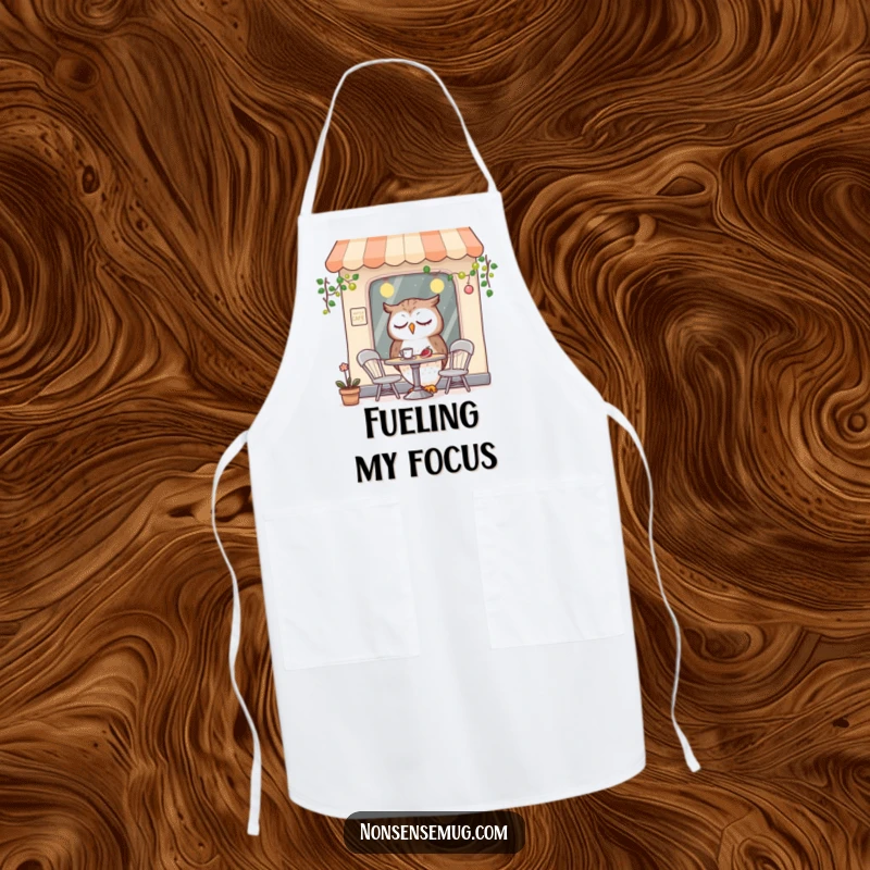 Funny kitchen apron adorned with a sleepy owl character enjoying a meal in a tiny, quirky cafe, ideal for cooking.