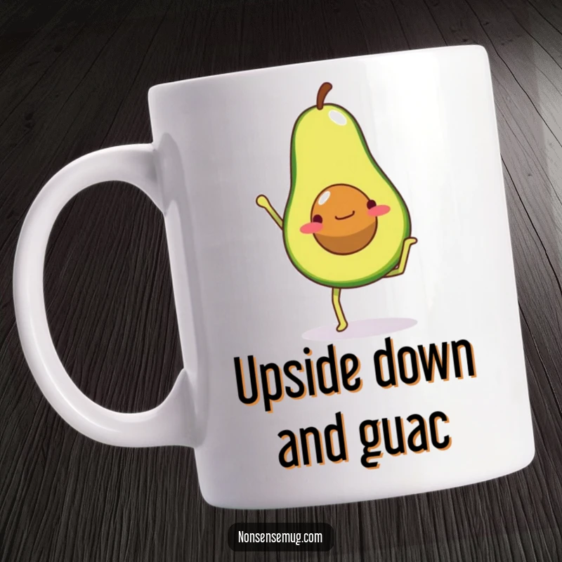 Funny mug depicting a determined avocado with stick legs, wobbling as it attempts a handstand, arms (or pit) reaching for the sky.