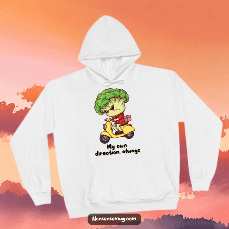 Funny grumpy broccoli character riding backwards on a tiny scooter, depicted on a cozy hoodie.