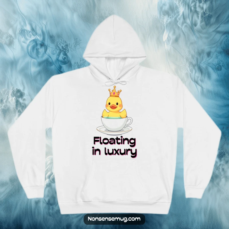 Funny crowned rubber duck floating in a teacup, designed for a cozy and humorous hoodie.
