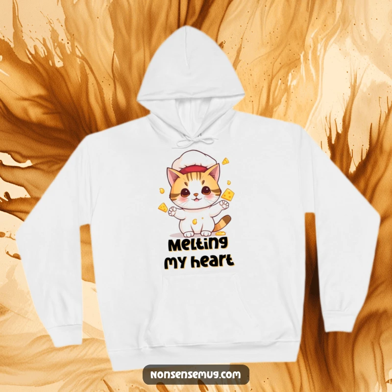 Funny hoodie print of a cat wearing a chef hat and juggling dripping, melting cheese, ideal for cozy and humorous wear.