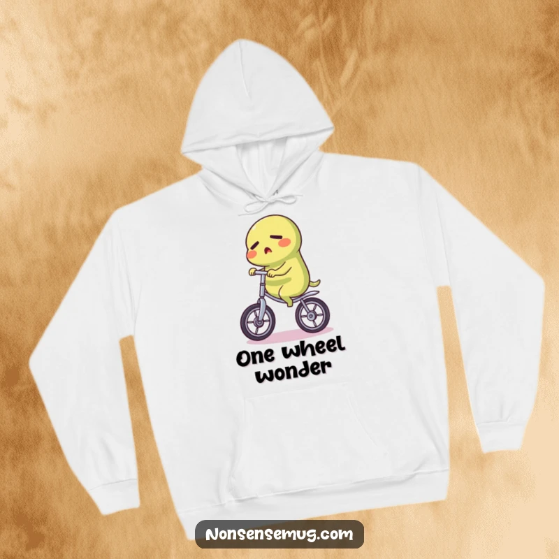 Funny Pickle Hoodie: A cozy hoodie featuring a determined pickle character balancing perfectly on a unicycle, ready for action.