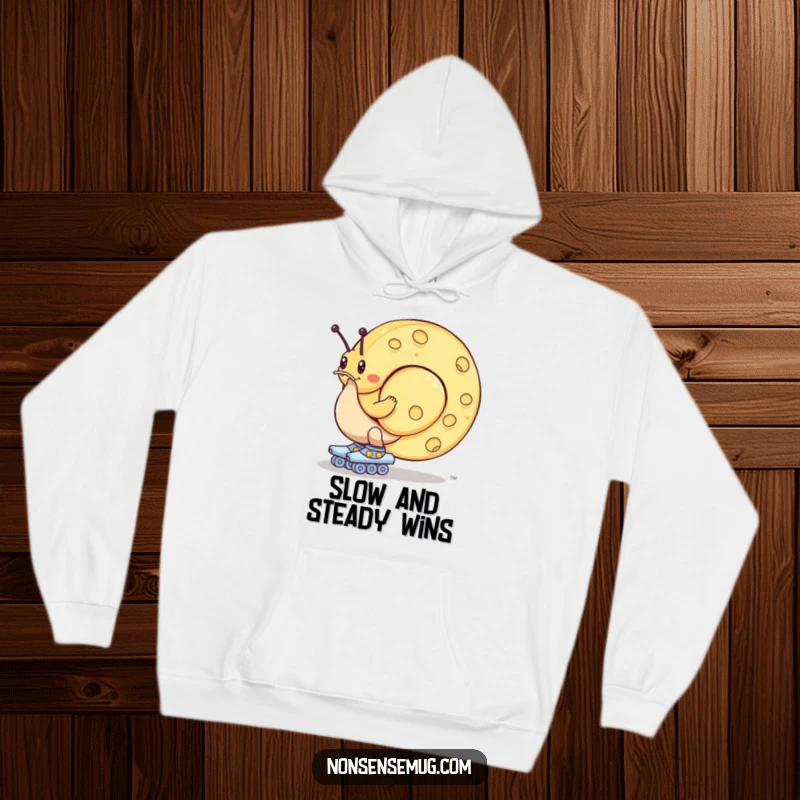 Funny hoodie: A snail equipped with roller skates ambitiously attempts to maneuver a massive cheese wheel with great effort.