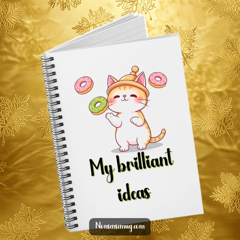 Funny notebook with a cat wearing a small hat, juggling three floating donuts, perfect for humorous notes and ideas.