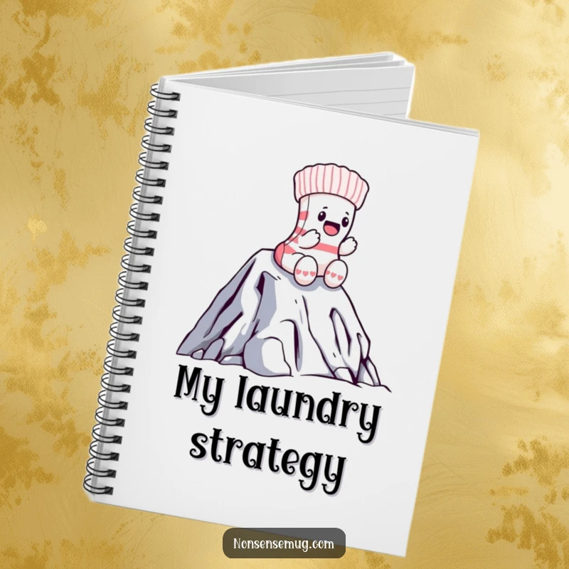 Funny sock notebook cover with a brave sock heroically climbing a laundry mountain, inspiring note-taking with adventurous humor.