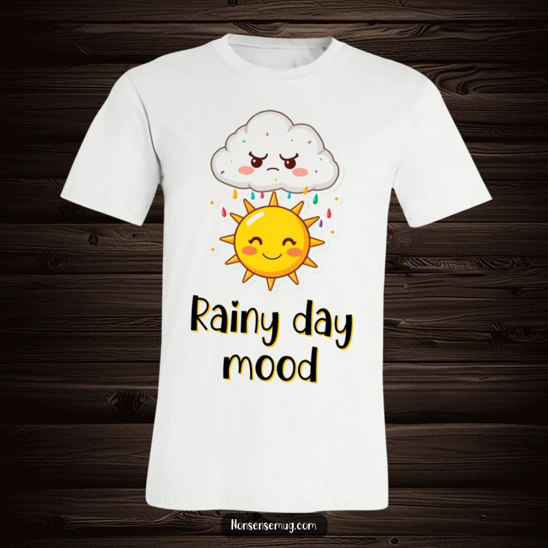 Funny t-shirt: A cartoon cloud with a frown raining colorful sprinkles onto a very happy, smiling sun. Expressive and humorous graphic.