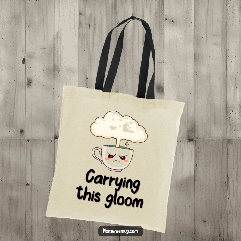 Funny tote bag with a disgruntled teacup being rained on by a cloud, a humorous accessory for carrying essentials with attitude.