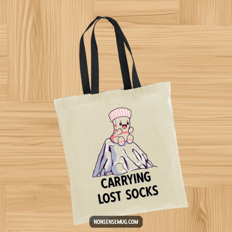 Funny sock tote bag showing a brave sock climbing a massive laundry pile, a humorous accessory for daily use.